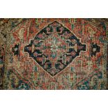 Small Heriz rug with medallion design (w