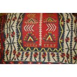 Kelim rug with geometric designs in red, blue and cream CONDITION REPORT 64ins x 44ins, as this is a