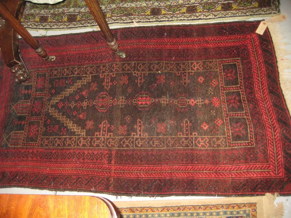 Floral design rug with red ground and bo