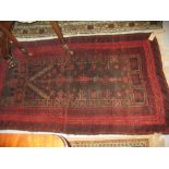 Floral design rug with red ground and bo