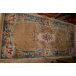 Small Chinese rug with beige ground and