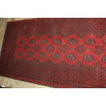 Modern red ground Afghan runner, 2.86m x 0.78m
N.B. This carpet is subject to vat on the hammer