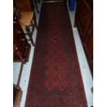 Modern red ground Afghan runner, 2.86m x