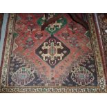 Small Afghan rug having red ground toget