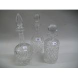Group of three various 20th Century cut glass circular decanters