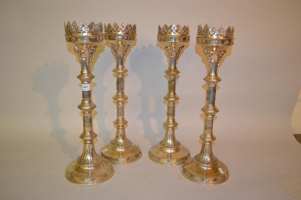 Set of four large reproduction silver plated pricket type candlesticks in Gothic style