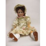 Armand Marseille bisque headed doll with open eyes and open mouth with four teeth, stamped 390