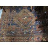Kazak rug having triple medallion design with multiple borders, 96ins x 59ins (worn)