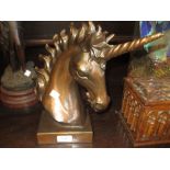 Reproduction patinated bronzed sculpture, the head of a unicorn