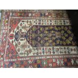 Early 20th Century Kurdish rug with a single large blue ground pole medallion on an ivory