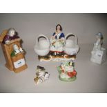 Continental porcelain group, ' The Vicar and Moses ', another of a seated lady with two baskets and