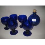 Set of five Bristol blue glass wine goblets together with a blue glass bottle