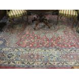 Large 20th Century Meshed carpet with medallion and all-over stylised floral design on a red ground