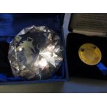 Cut crystal paperweight and a gilt metal coin