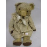 Large straw stuffed jointed teddy bear