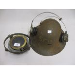 World War II military helmet, a ships compass on gimbal with M.O.D. arrow mark, No. 6B / 1672 and a