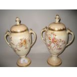 Pair of Royal Bonn floral decorated blush ivory two handled vases with covers