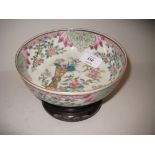 Small 20th Century Canton famille rose bowl on a hardwood stand, 6ins diameter