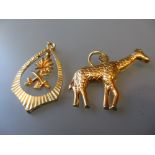 Two yellow metal pendants, one in the form of a giraffe