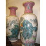 Pair of late 19th or early 20th Century Canton vases of baluster form decorated with continuous