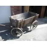 Antique pine and iron mounted dog cart with removable sides and four cartwheels