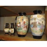 Pair of large Satsuma pottery vases decorated with figures in landscapes together with a smaller