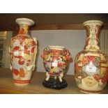 Pair of Satsuma baluster form vases and a similar smaller vase