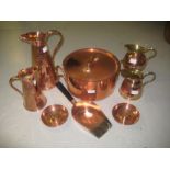 Two Art Nouveau copper embossed jugs, a 19th Century copper lidded cooking pot, two coin inset