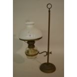 Early 20th Century brass adjustable oil lamp with clear glass well and opaque glass shade (lacking