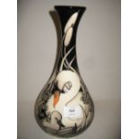 Moorcroft baluster form vase decorated with swans and cygnet in bullrushes, No. 555, dated 2012,