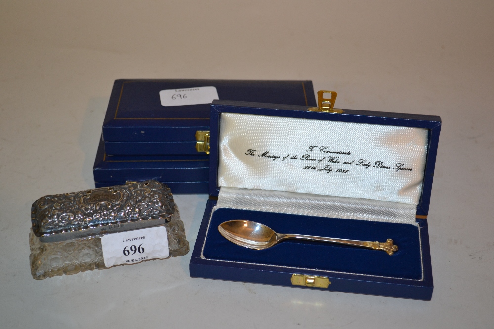 Small cut glass silver mounted dressing table bottle and three cased silver commemorative spoons