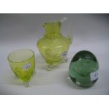 Victorian green glass dump weight together with an early 20th Century green glass water jug and