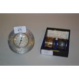 Circular Birmingham silver mounted dressing table clock and a cased pair of silver napkin rings