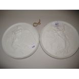 Pair of late 19th Century Continental bisque wall plaques decorated with classical scenes in