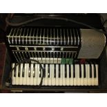 Hohner Electravox piano accordion in original fitted case with transformer