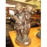 20th Century patinated bronze group of a boy and girl