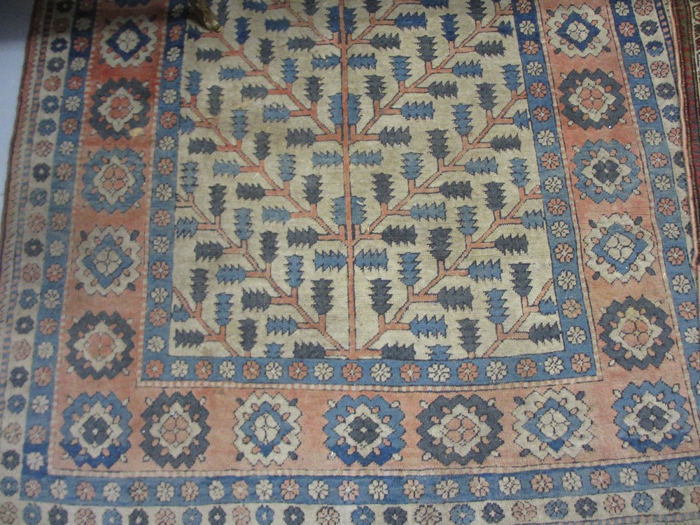 20th Century Turkish rug with tree of life design on an ivory ground with borders, 7ft x 5ft