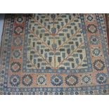 20th Century Turkish rug with tree of life design on an ivory ground with borders, 7ft x 5ft