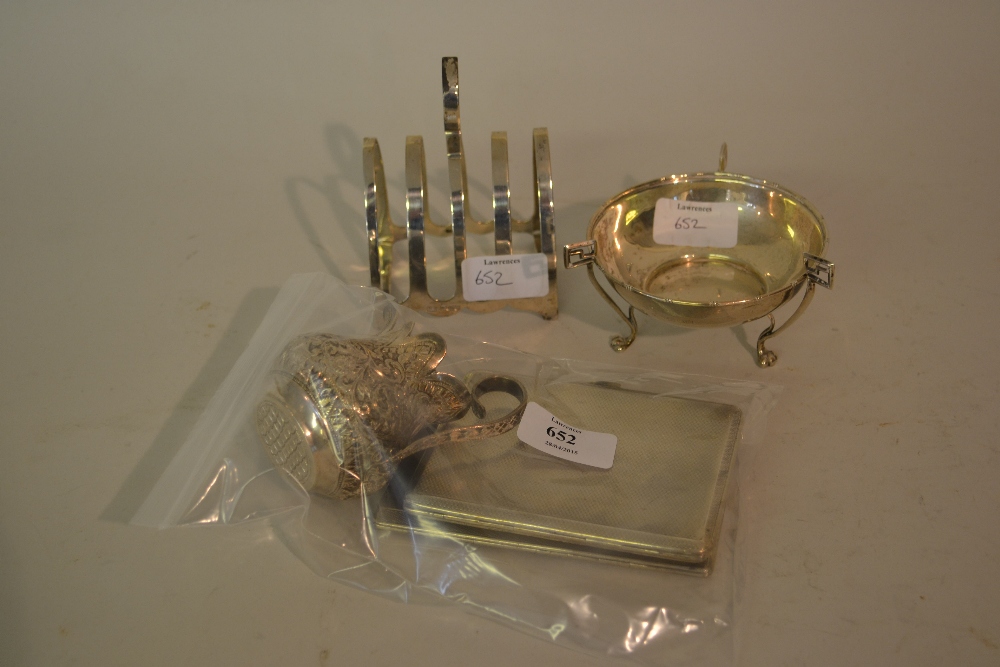 Two silver cigarette cases, silver toast rack, trinket dish and an oriental white metal cream jug