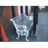 White painted cast aluminium and wooden slatted garden bench