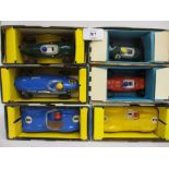Three boxes containing a collection of later Scalextric models and accessories