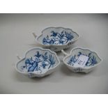 Graduated set of three Meissen blue and white onion pattern single handled leaf form dishes