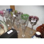 Set of six coloured overlay and cut hock glasses together with a set of four floral etched Limited