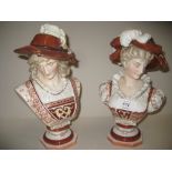 Pair of K.P.M. Berlin porcelain busts of a lady and gentleman with feathered hats