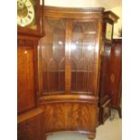 Pair of good quality reproduction mahogany inverted bow front standing corner cabinets