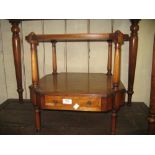 Reproduction yew wood and crossbanded two tier occasional table with a single drawer raised on