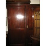 Early 20th Century mahogany wardrobe having moulded cornice above two panelled doors and single