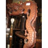 Chinese carved hardwood lamp standard in the form of a dragon
