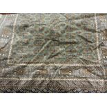 Modern green ground Bokhara pattern machine made rug, 1.9m x 1.4m