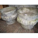 Pair of circular cast concrete garden planters relief moulded with lion masks